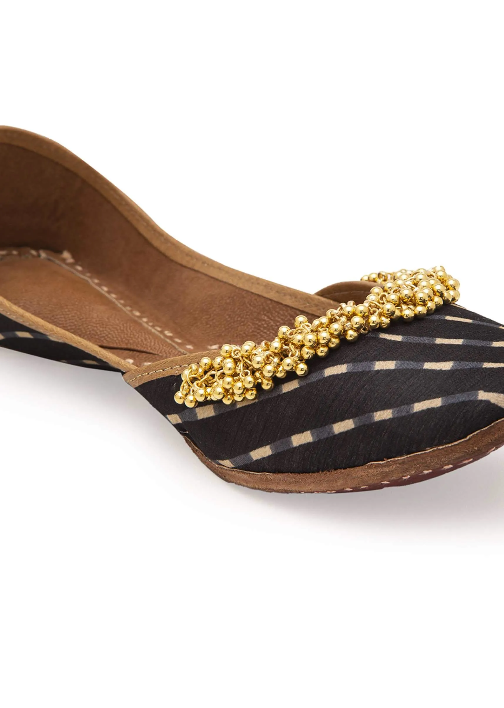 Black Geometric Print Juttis In Silk With Ghungroo Embellishment