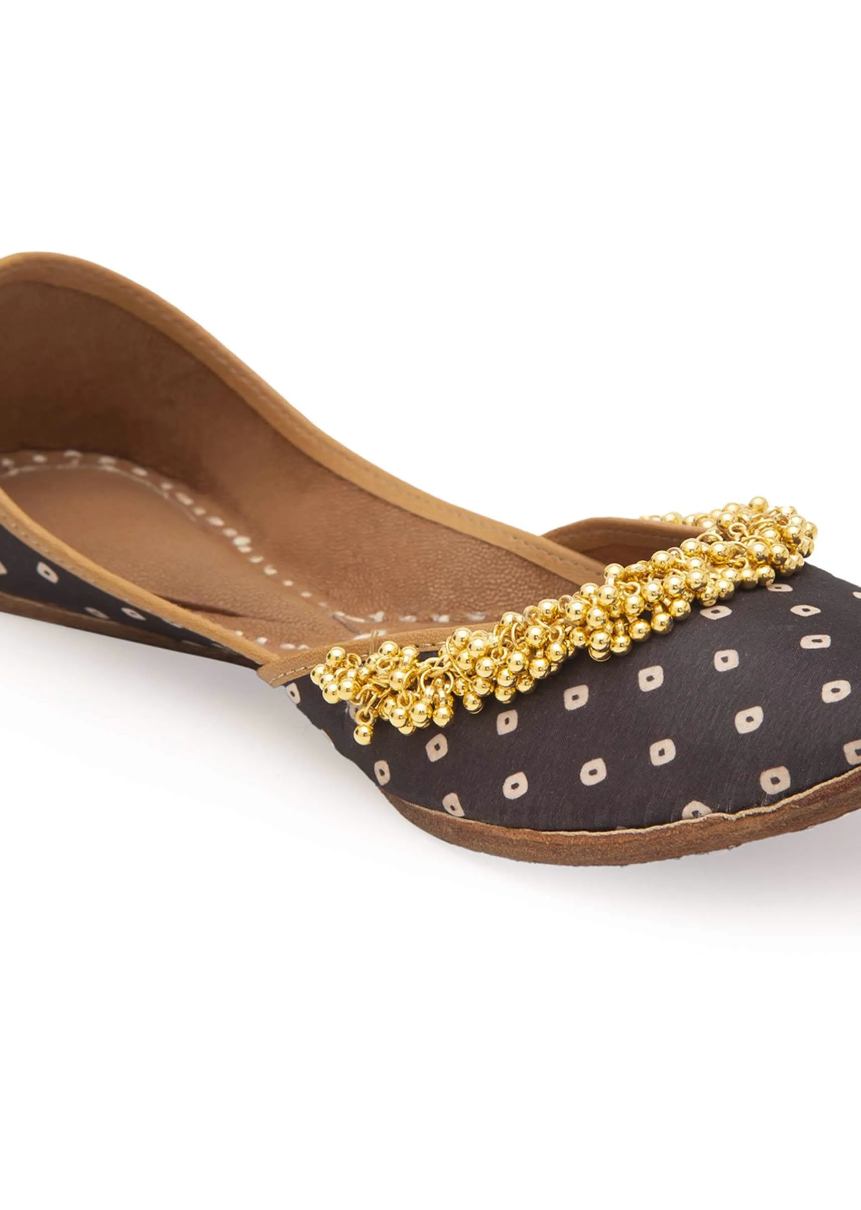 Black Print Juttis In Silk With Ghungroo Embellishment And Geometric Print