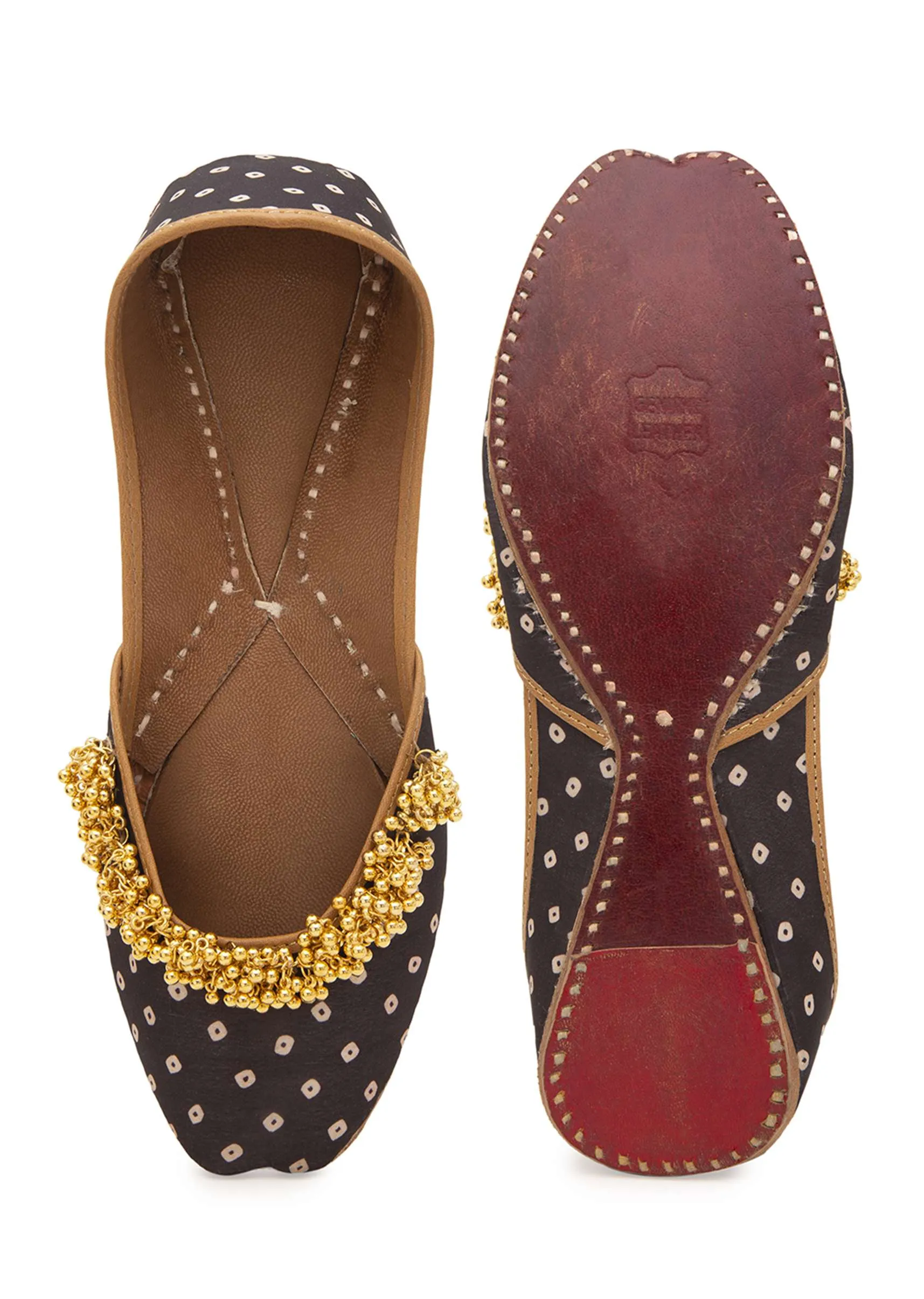 Black Print Juttis In Silk With Ghungroo Embellishment And Geometric Print